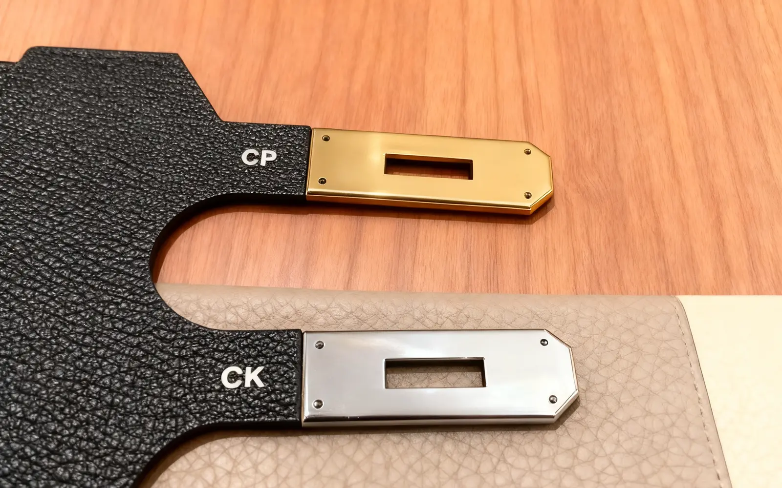 Gold and silver hardware finishes paired with black and pale leather samples