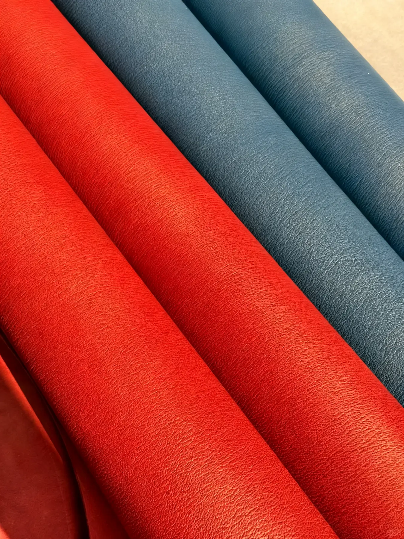 Red and blue rolls of supple Swift leather